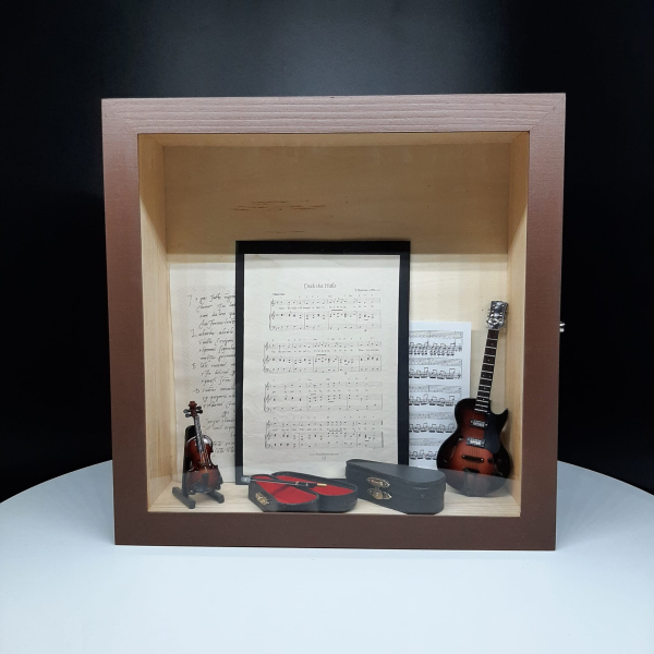The Enduring Sophistication of a Shadow Box as a Gift for Your Mentor
